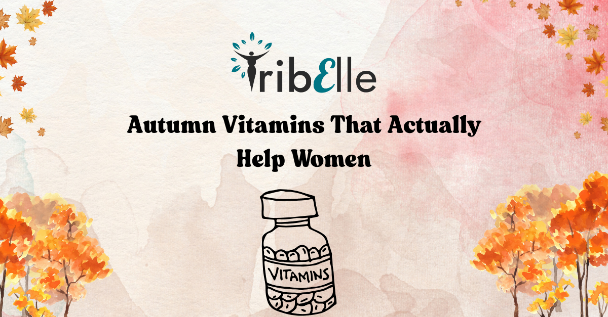 Blog header image with TribElle logo. Title text reads: ‘Autumn Vitamins That Actually Help Women.’ Illustration of a vitamins bottle at the centre. Background features a soft watercolour wash with autumn trees and falling leaves.